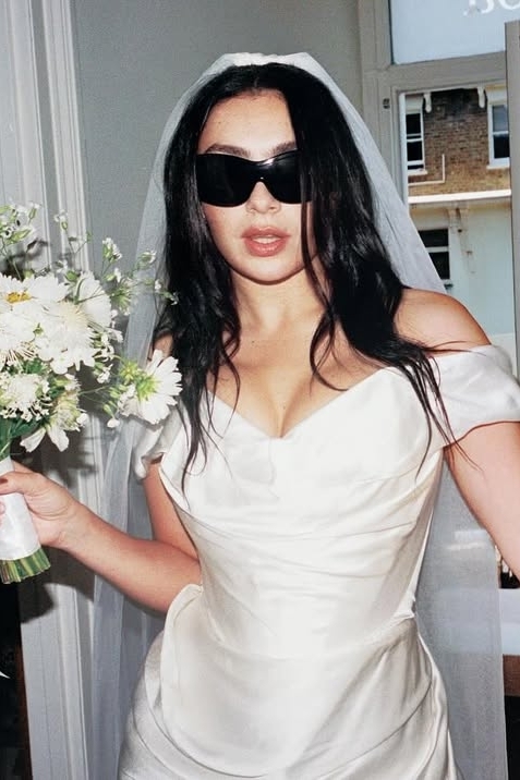 charli xcx wedding dress Charli xcx wore a custom silk chiffon Colleen Allen bridal gown for her  wedding reception in Sicily. 
