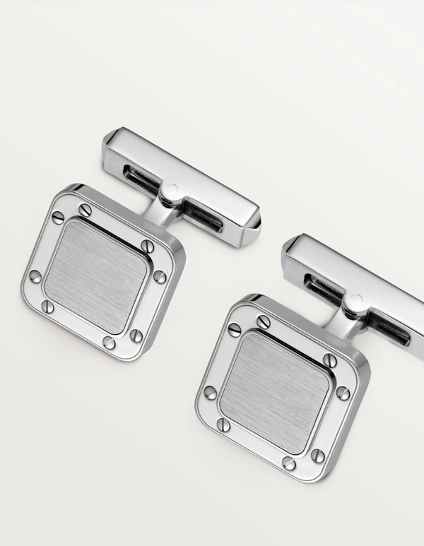 <a href="https://www.cartier.com/en-us/bags-and-accessories/accessories/cufflinks-%26-dress-accessories/santos-de-cartier-cufflinks-CROG000163.html">CARTIER Santos De Cartier Cufflinks, $580</a>