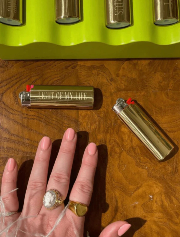 <a href="https://abbode.com/products/custom-lighter-case?srsltid=AfmBOooOnsayjwBnbAQA5keZFPmtun-RHwJxdmEKTDG7dSD4IFJOfU9r&variant=43645891870977">ABBODE Custom Engraved Lighter, $55</a>