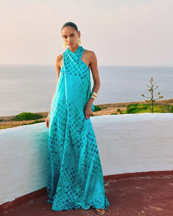 <a href="https://dimaayad.com/collections/dresses/products/polka-dot-gathered-halter-neck-dress-copy?variant=47611407433891">DIMA AYAD Polka Dot Halter Dress</a>, $1,420