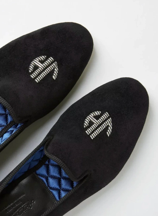 <a href="https://thegoto.com/products/hand-embroidered-velvet-monogram-loafers">THE GO-TO Hand-Embroidered Velvet Monogram Loafers, $1,636</a>