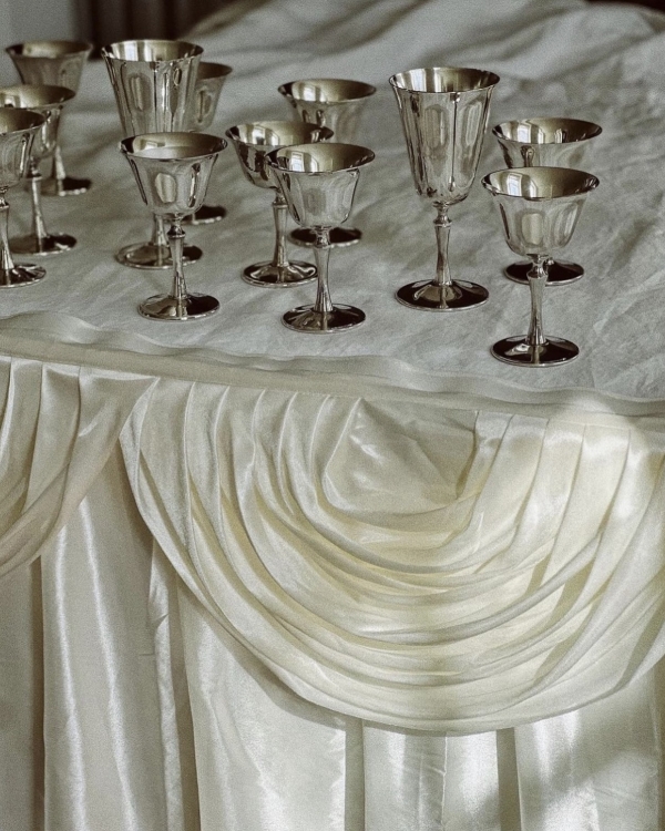 Classical European for Wedding Decor | Draped Fabrics, Candles, and Antique Silverware