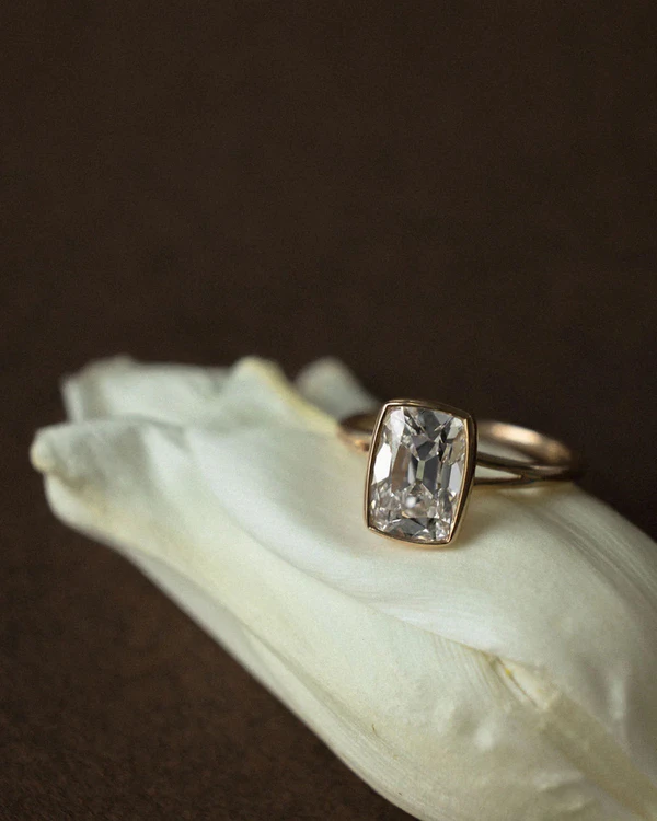 <a href="https://junerings.com/products/antique-cut-fleur-old-mine-elongated-cushion">June Rings</a>