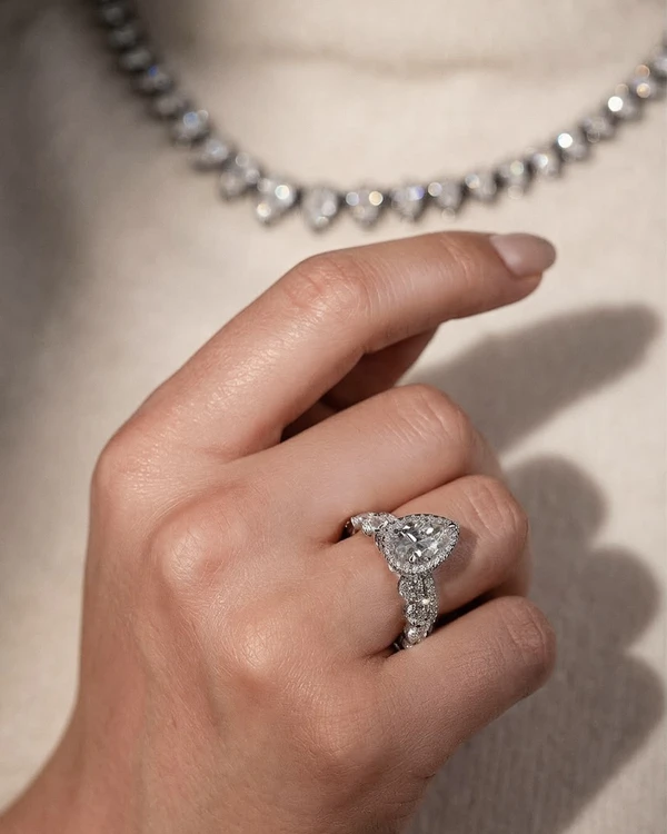 <a href="https://www.vrai.com/engagement-ring/signature-halo/pear-white-gold-16167957463106">VRAI Ring</a>, $1,780
