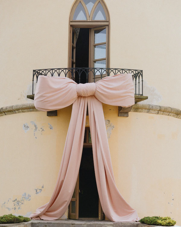 A Whimsical Wedding with a Giant Bow & Curved Tablescape