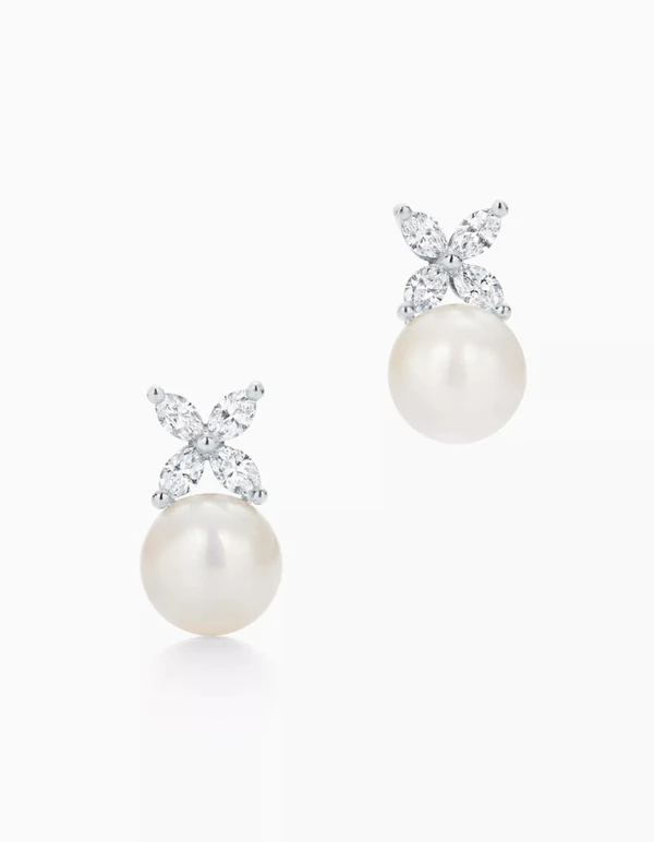 <a href="https://www.tiffany.com/jewelry/earrings/tiffany-victoria-platinum-cultured-pearl-earrings-1541575889.html?queryID=a2b42c4f50c7bca3b7d063cff9a02737&objectID=60152975&indexName=ecommerce_us_products__en_US&searchQuery=bridal+earrings&variantId=1541575889">TIFFANY & CO. Pearl Earrings, $8,500</a>