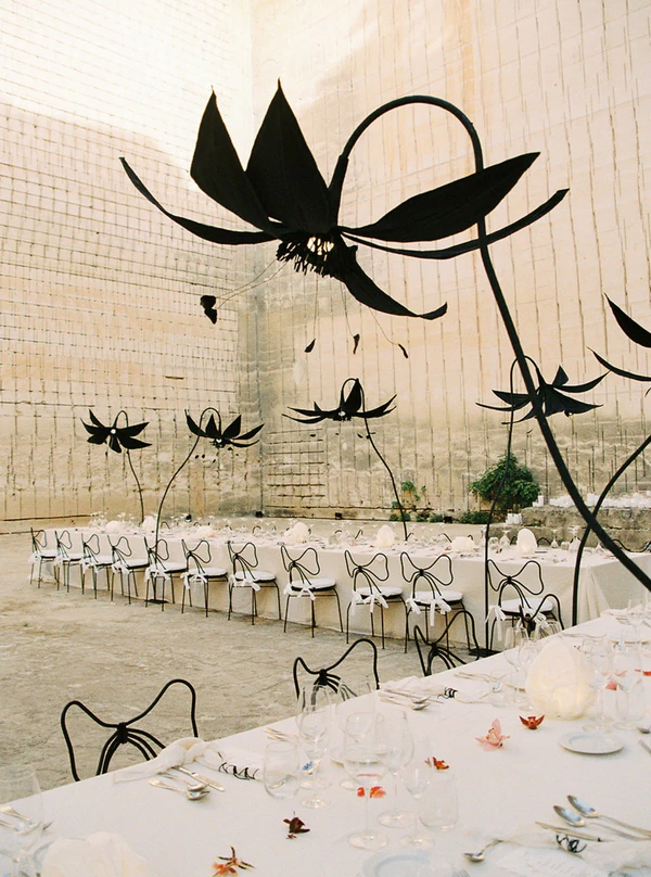 <a href="https://www.instagram.com/lithica.pedreresdeshostal/">Lithica</a>, Photography: <a href="https://thewed.com/magazine/stone-quarry-wedding-menorca-sculptural-florals-mia-sylvia-drapery" target="_blank" rel="noopener noreferrer">Días de Vino y Rosas</a>
