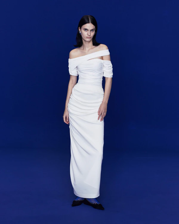 <a href="https://lejeofficial.com/shop/asymmetric-ruched-jersey-dress-white/" target="_blank">LEJE Asymmetric Ruched Jersey Dress, $810</a>