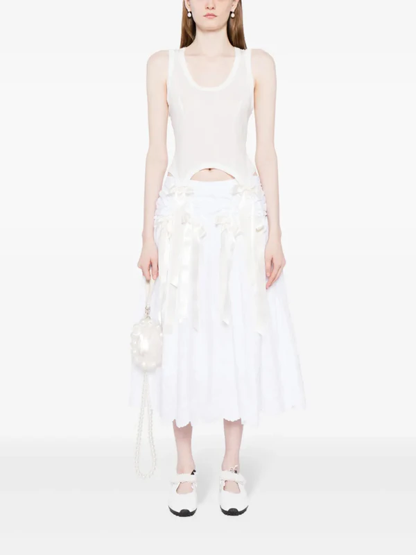 <a href="https://www.farfetch.com/shopping/women/simone-rocha-easy-bow-tails-cotton-tank-top-item-22555499.aspx#regionchange">SIMONE ROCHA Top</a> from Farfetch, $255