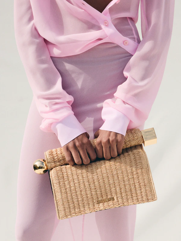 <a href="https://www.jacquemus.com/en_us/the-rond-carre-clutch/BAW00356AW006031FY.html">JACQUEMUS The Rone Carre Clutch</a>, $1,250