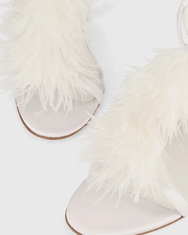 <a href="https://katmaconie.com/en-us/products/faryal-white-feather?srsltid=AU7gw4W9NyLTFuTXj_J0gTxS4f43z1K1l0wR9CvVh50MCWrVGc__sUnw">KAT MACONIE Faryal Stiletto Sandals</a>, $345