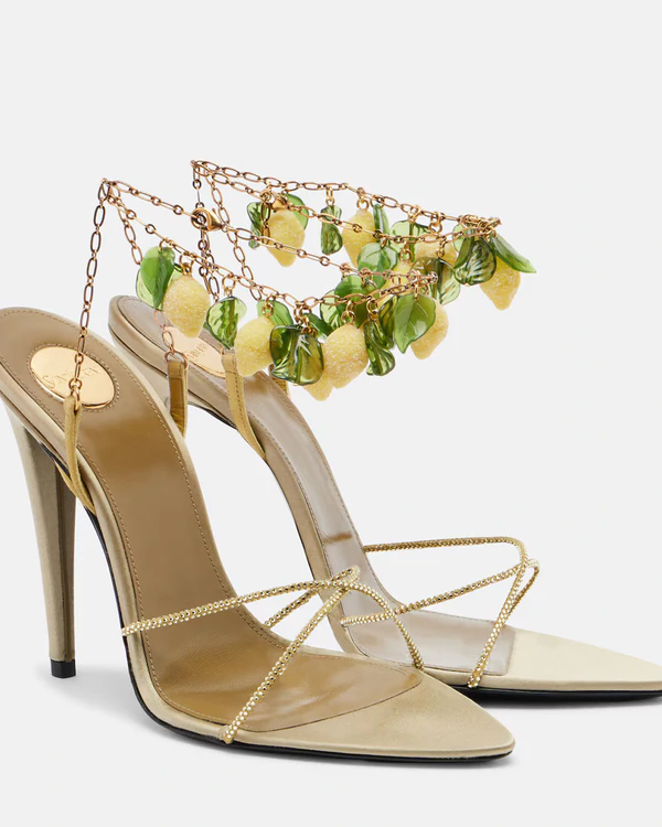 <a href="https://www.mytheresa.com/us/en/women/saint-laurent-mon-cheri-110-embellished-leather-slingback-sandals-green-p01135890">SAINT LAURENT Mon Chéri Embellished Suede Sandals</a> from Mytheresa, $2,500