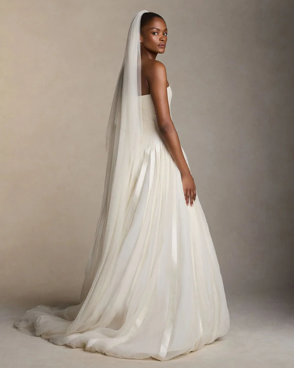 <a href="https://www.daniellefrankelstudio.com/products/simple-tulle-veil-w-blusher">DANIELLE FRAKEL Veil</a>, $990