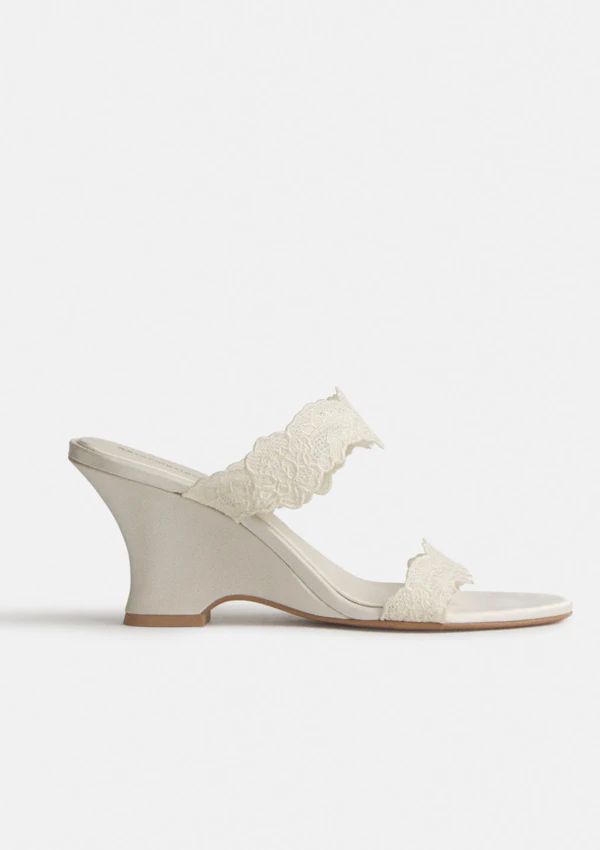 <a href="https://www.thereformation.com/products/fiorella-wedge-sandal/1320343KAS.html?_gl=1*1avgnve*_up*MQ..*_gs*MQ..&amp;gclid=CjwKCAjw_KjVBhAHEiwAnC0N9DF-3jIUfsENWQqtITtit8wdQU76NJSIHPVF-FDdbDH299cdCElpehoC84MQAvD_BwE&amp;gbraid=0AAAAADmLagUekqBwbJq6pWsecmzoPJeGK&amp;dwvar_1320343KAS_color=DLT&amp;quantity=1">REFORMATION Satin &amp; Lace Wedge Sandals, $328</a>