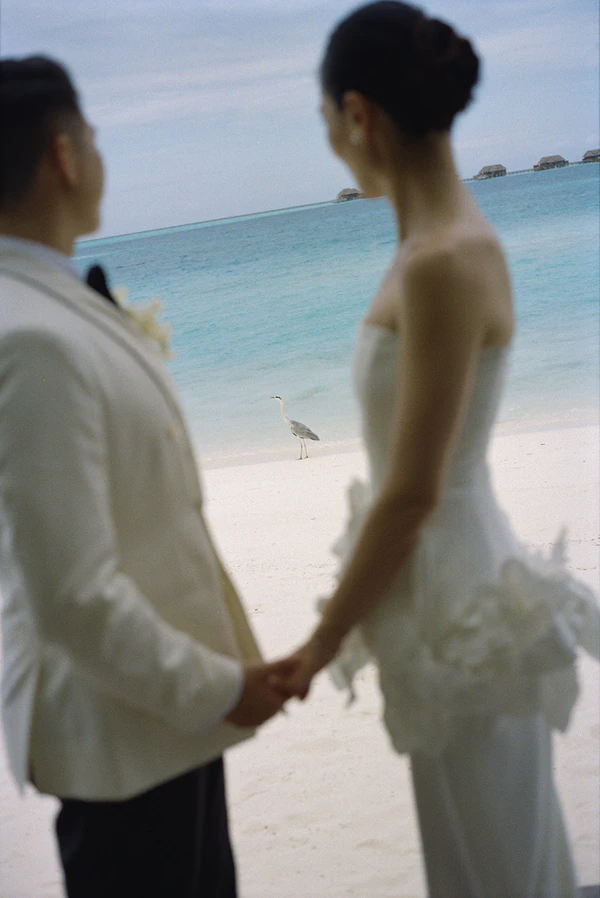 10,000 Lilies & Turquoise Waters Framed This Dreamy Beach Wedding in the Maldives