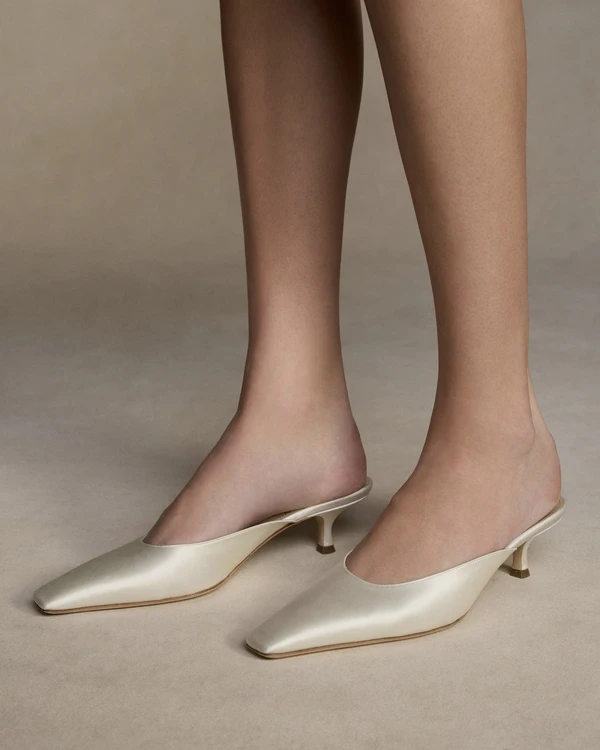 <a href="https://www.daniellefrankelstudio.com/products/finn">DANIELLE FRANKEL Finn Mules</a>, $890