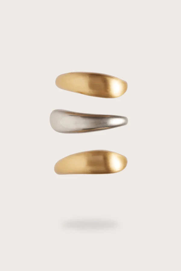 <a href="https://cultgaia.com/products/analeia-cuff-set-brushed-brass-antique-silver?variant=43312799875146">CULT GAIA Cuff Set</a>, $398
