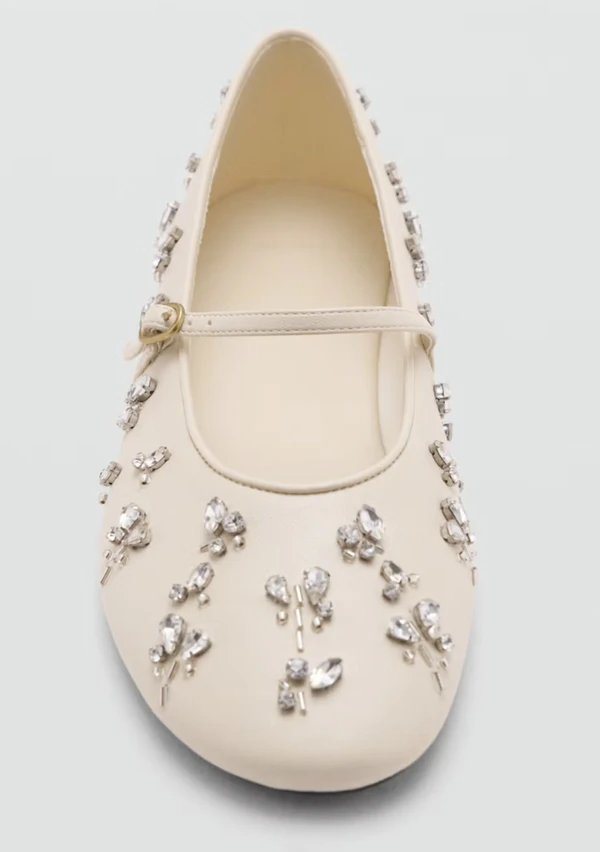 <a href="https://shop.mango.com/us/en/p/women/shoes/ballet-flats/ballerina-with-gem-detail/37096353/05/00">MANGO Gem-Detail Ballet Flats, $89.99</a>