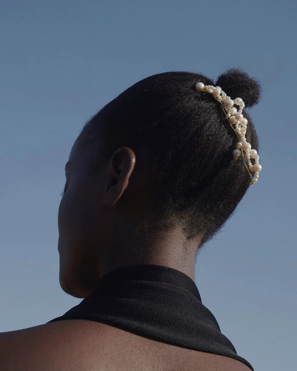 <a href="https://us.completedworks.com/collections/hair-accessories/products/p66-pearl-and-gold-plated-hair-pin?variant=40174789099625">COMPLETEDWORKS P66 Pearl and Gold Plated Hair Pin</a>, $410