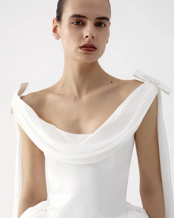 <a href="https://us.ilkyazozel.com/products/morticia-gown-in-celeste">ILKYAZ OZEL Gown</a>, $2,125