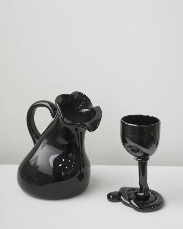 <a href="https://us.completedworks.com/collections/homeware-glass-1/products/thaw-recycled-glass-jug-in-black?variant=55950710964602">COMPLETEDWORKS Large Recycled Glass Jug</a>, $376