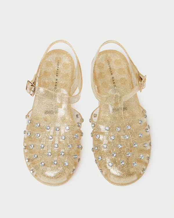 <a href="https://loefflerrandall.com/products/rhys-champagne-glitter-jelly-sandal">LOEFFLER RANDALL Rhys Champagne Glitter Jelly Sandal</a>, $175
