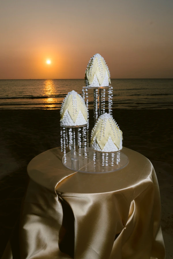 A Cinematic Beach Wedding in Vietnam with a Sunset Ceremony Framed by Dandelions