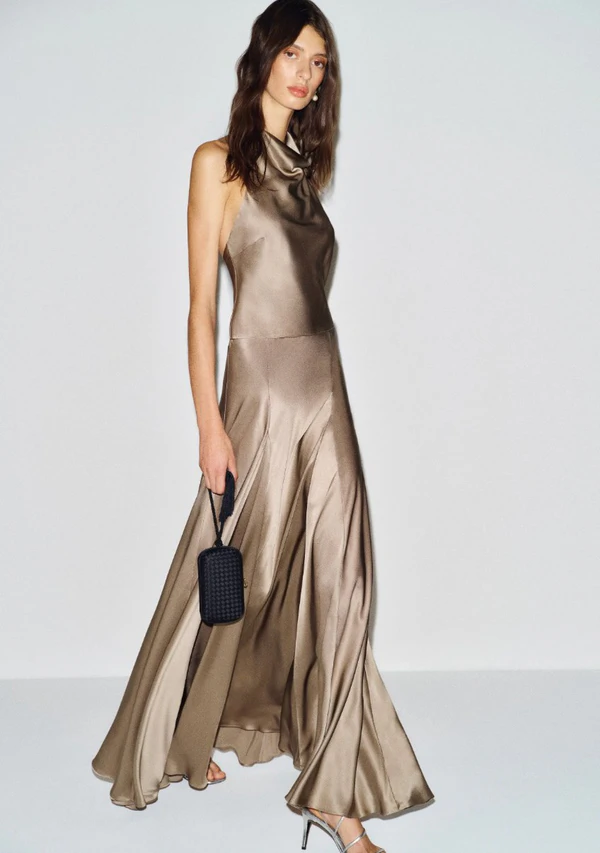 <a href="https://www.thereformation.com/products/sera-silk-two-piece/1317833PVT.html?dwvar_1317833PVT_color=PVT&_gl=1*14on9xw*_up*MQ..*_gs*MQ..&gclid=CjwKCAjwzNTUBhAjEiwA7zcvWroKeTPhxmiq7nkPLQUcJ_76wVkIJCvZsvp4-8z9Jx793bogw59WHxoCt9oQAvD_BwE&gbraid=0AAAAABnwCwfh55BtIHa06_fa5kBq2iKme">REFORMATION Sera Silk Two Piece in Pavement, $598</a>
