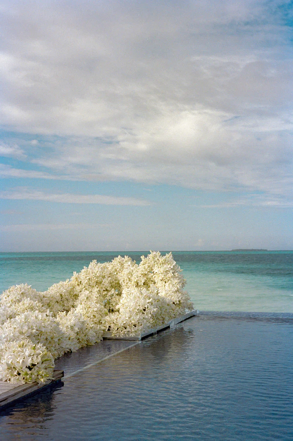 10,000 Lilies & Turquoise Waters Framed This Dreamy Beach Wedding in the Maldives