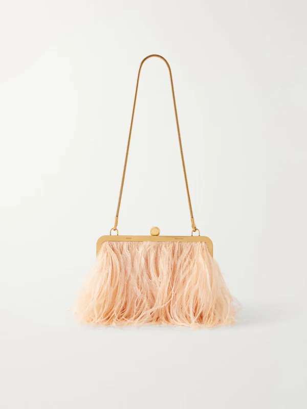 <a href="https://www.net-a-porter.com/en-us/shop/product/khaite/bags/shoulder-bags/lilith-feather-trimmed-satin-shoulder-bag/46376663163139627">KHAITE Lilith Feather-Trimmed Satin Shoulder Sag from Net-a-Porter</a>, $4,400