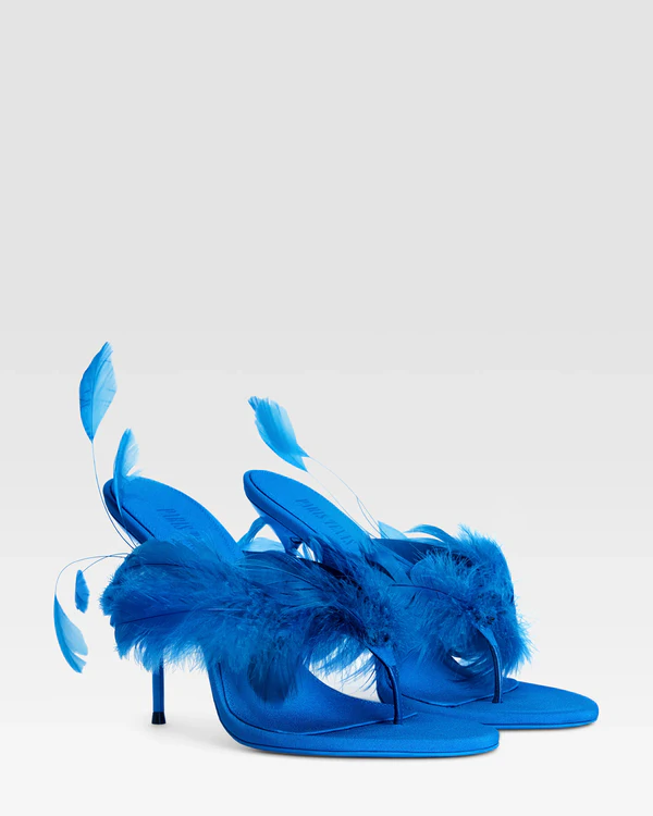 <a href="https://us.paristexasbrand.com/products/thong-mules-in-turquoise-crepe-satin-px1821xcrpf408blue?variant=45910997500035">PARIS TEXAS Lida Feather Thong Mule 105</a>, $1,250