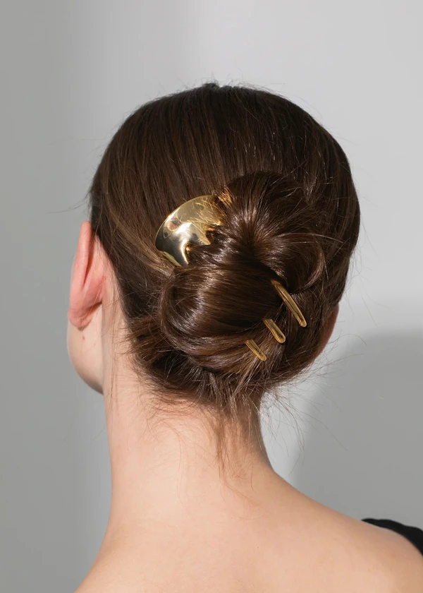 <span><a href="https://www.jenniferbehr.com/collections/hair-accessories/products/mina-hair-pin-gold?variant=Gold&amp;amp;">JENNIFER BEHR Mina Hair Pin</a>, $198</span>