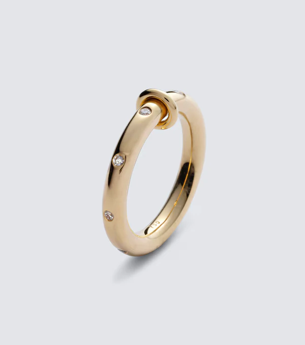 <a href="https://www.mytheresa.com/us/en/men/spinelli-kilcollin-ovio-18kt-gold-ring-with-diamonds-gold-p00820379">SPINELLI KILCOLLIN Ring</a> from Mytheresa, $5900