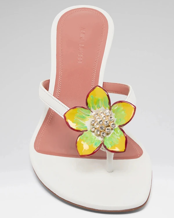 <a href="https://www.aminamuaddi.com/en-us/products/vittoria-thong-45-white-nappa-and-green-yellow-enamel-flower">AMINA MUADDI Vittoria Thong Slipper 45</a>, $1,225