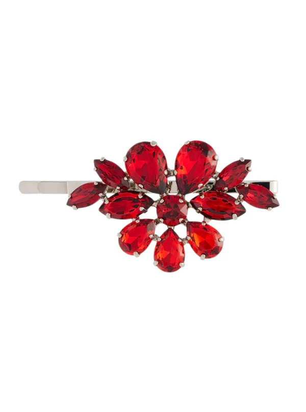 <a href="https://www.mytheresa.com/us/en/women/simone-rocha-crystal-embellished-hair-clip-red-p01206219">SIMONE ROCHA Hair Clip</a> from Mytheresa, $290