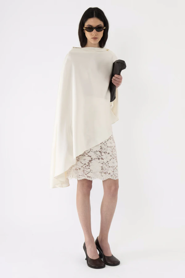 <a href="https://arakii.com/p/velvet-lace-pencil-skirt-off-white">ARAKII Top, $330</a>, ARAKII Skirt, $280