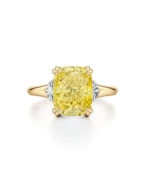 <a href="https://jeandousset.com/products/jane-3-05-ct-elongated-cushion-cut-yellow-diamond-three-stone-engagement-ring?variant=48655613493503&">Jean Dousset</a>