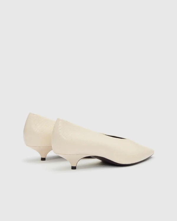 <a href="https://www.thereformation.com/products/calista-kitten-heel-pump/1319518AWN.html?dwvar_1319518AWN_color=AWN">REFORMATION Calista Kitten Heel Pump</a>, $298