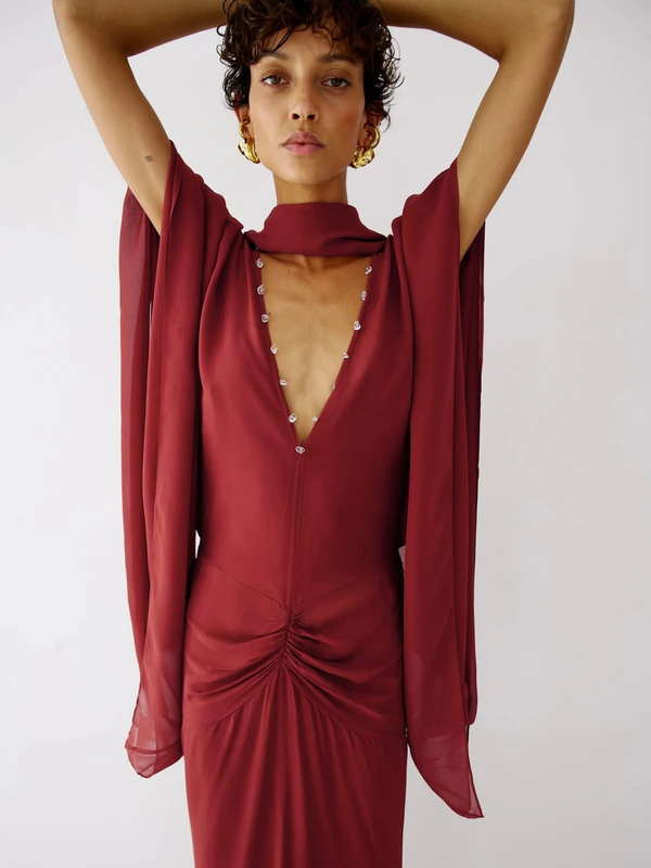 <a href="https://www.delavali.com/products/florencia-maxi-dress-in-burnt-red-viscose-georgette">DE LA VALI Florencia Maxi Dress in Burnt Red Georgette, $951</a>
