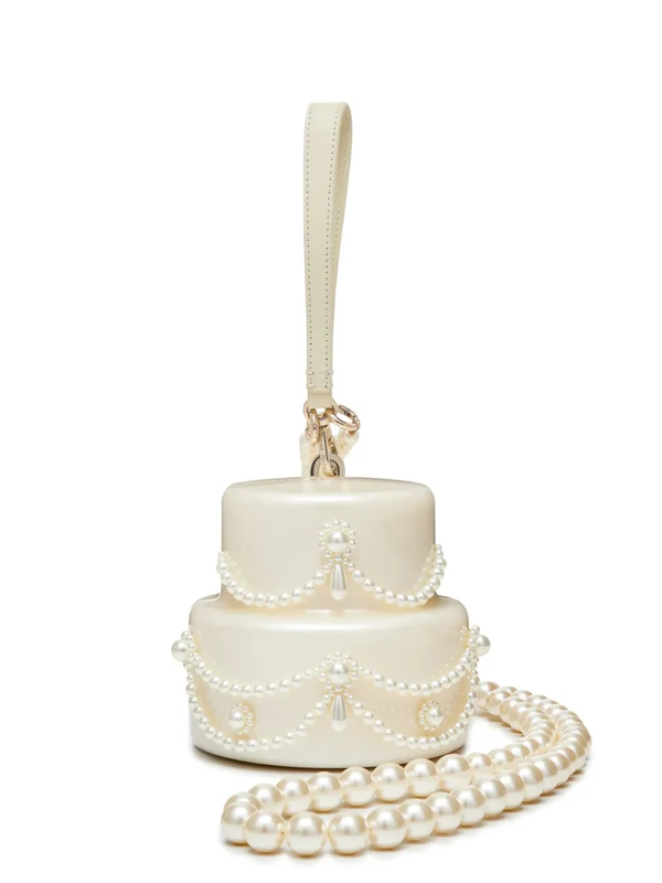 <a href="https://www.farfetch.com/shopping/women/simone-rocha-pearl-embellished-cake-mini-bag-item-22662152.aspx#regionchange">SIMONE ROCHA Bag</a> from Farfetch, $1,206