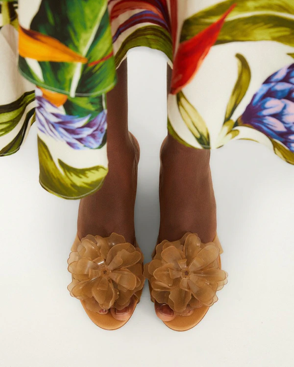 <a href="https://farmrio.com/products/flower-jelly-wedge-sandal">FARM RIO Orange Jelly Flower Wedge Sandal</a>, $198