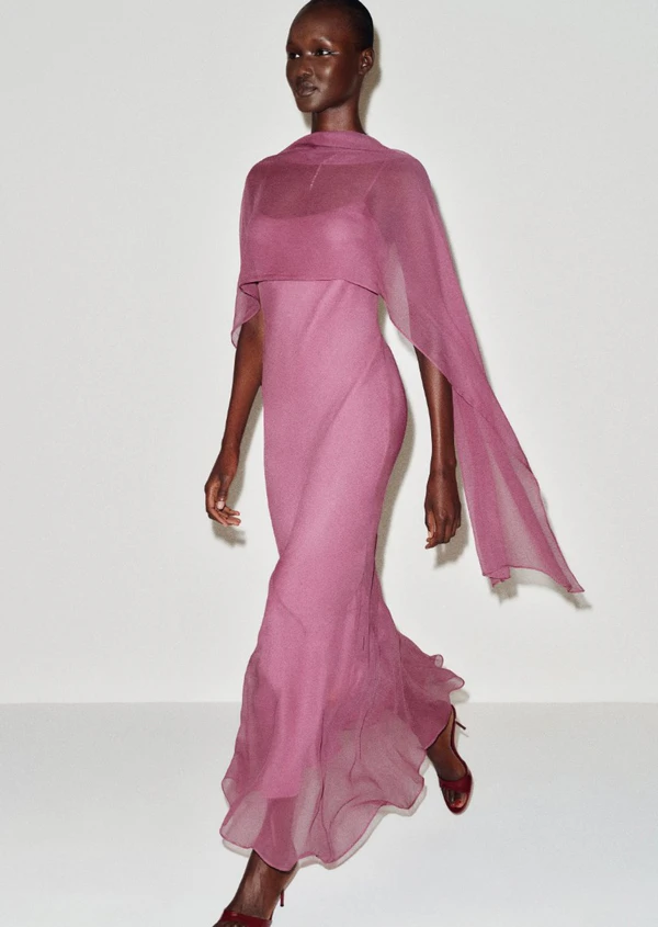 <a href="https://www.thereformation.com/products/rida-silk-chiffon-dress/1320559SMZ.html?dwvar_1320559SMZ_color=SMZ&_gl=1*4apukn*_up*MQ..*_gs*MQ..&gclid=CjwKCAjwzNTUBhAjEiwA7zcvWroKeTPhxmiq7nkPLQUcJ_76wVkIJCvZsvp4-8z9Jx793bogw59WHxoCt9oQAvD_BwE&gbraid=0AAAAABnwCwfh55BtIHa06_fa5kBq2iKme">REFORMATION Rida Silk Chiffon Dress in Smoky Lilac, $428</a>