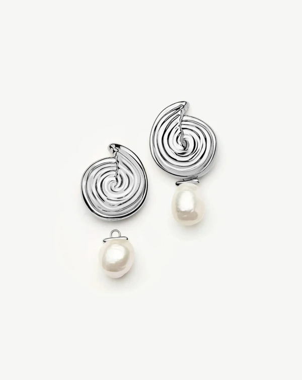 <a href="https://us.missoma.com/products/spiral-interchangeable-pearl-drop-earrings-silver-plated">MISSOMA Earrings</a>, $270