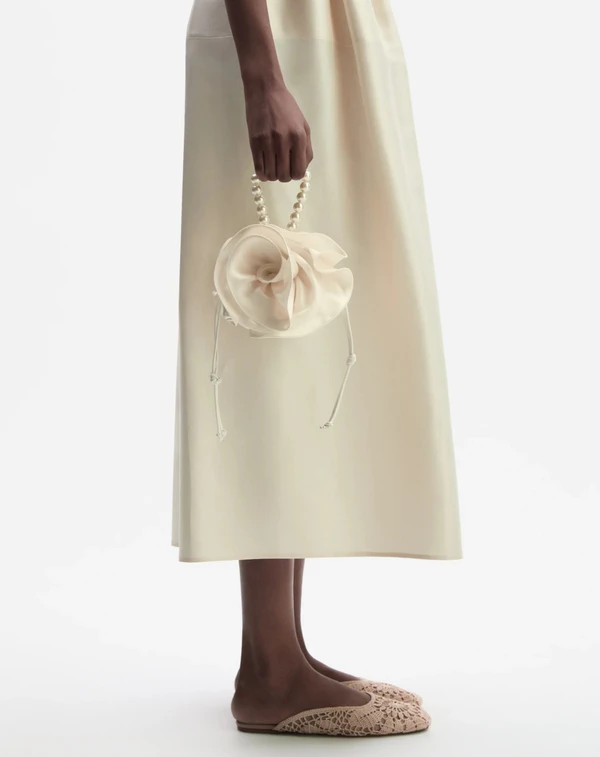 https://www.magdabutrym.com/us-en/product/pf23-magda-bag-cream-satin-pearl