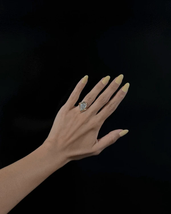 <a href="https://jonneamaya.com/capsule-collection/intertwined-setting-pear/">JONNE AMAYA Ring</a>, $3,800