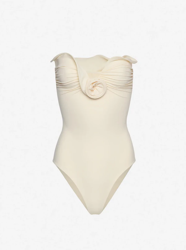 <a href="https://www.magdabutrym.com/us-en/product/pf24-swimsuit-05-cream">MAGDA BUTRYM Sculptural Rose Bustier Swimsuit</a>, $655