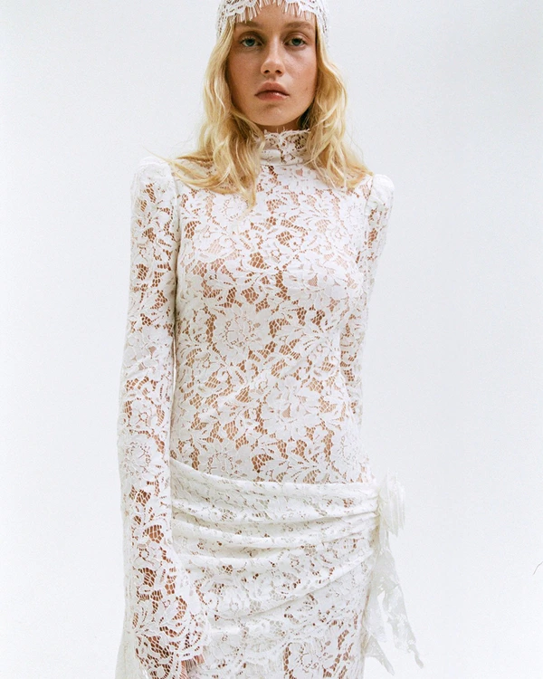 <a href="https://www.delavali.com/products/bodita-maxi-dress-in-white-lace" target="_blank">DE LA VALI Bodita Maxi Dress, $865</a>
