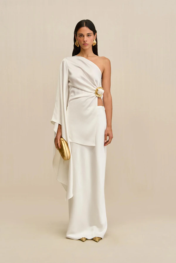 <a href="https://cultgaia.com/products/jadis-top-off-white-pf25?variant=42089943203914">CULT GAIA Top</a>, $598, <a href="https://cultgaia.com/products/chantel-skirt-off-white-hammered-satin?variant=42035136987210">CULT GAIA Skirt</a>, $598