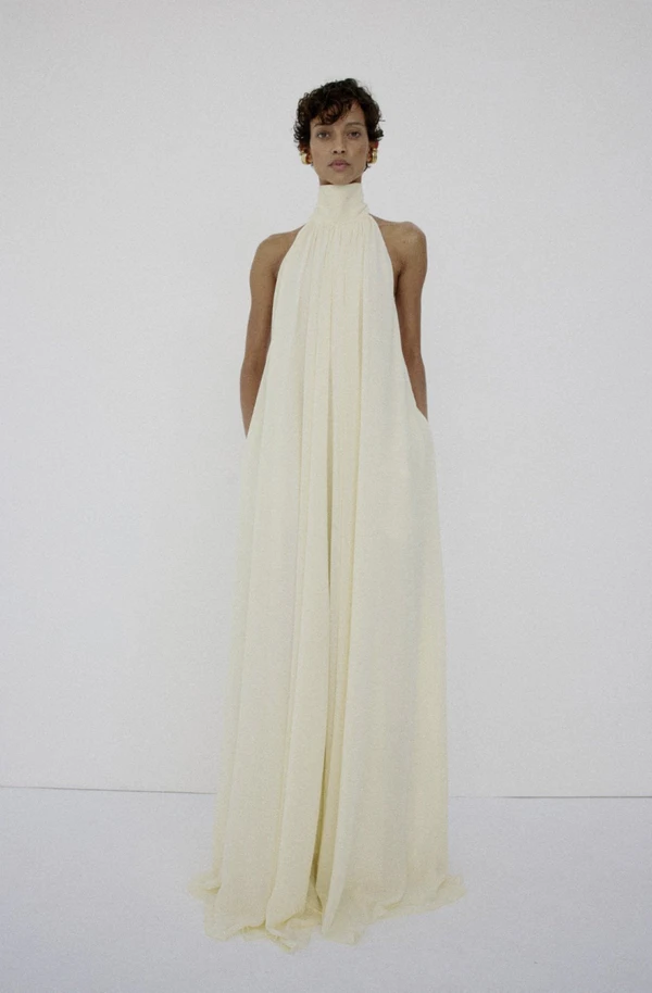 <a href="https://www.delavali.com/products/adela-maxi-dress-in-bright-cream-chiffon">DE LA VALI Chiffon Maxi Dress, $825</a>