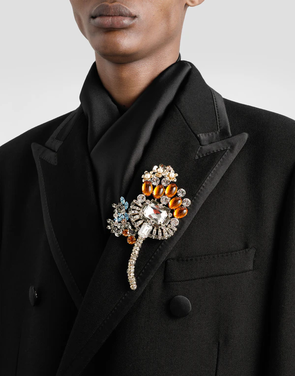 <a href="https://www.dolcegabbana.com/en-us/fashion/men/accessories/bijoux/maxi-floral-brooch-with-rhinestones-multicolor-WPR7F8W111187579.html">Dolce &amp; Gabbana</a>
